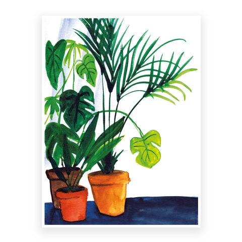 Marta Chojnacka print monstera and palmtree in plantpots in the frame between house plants.